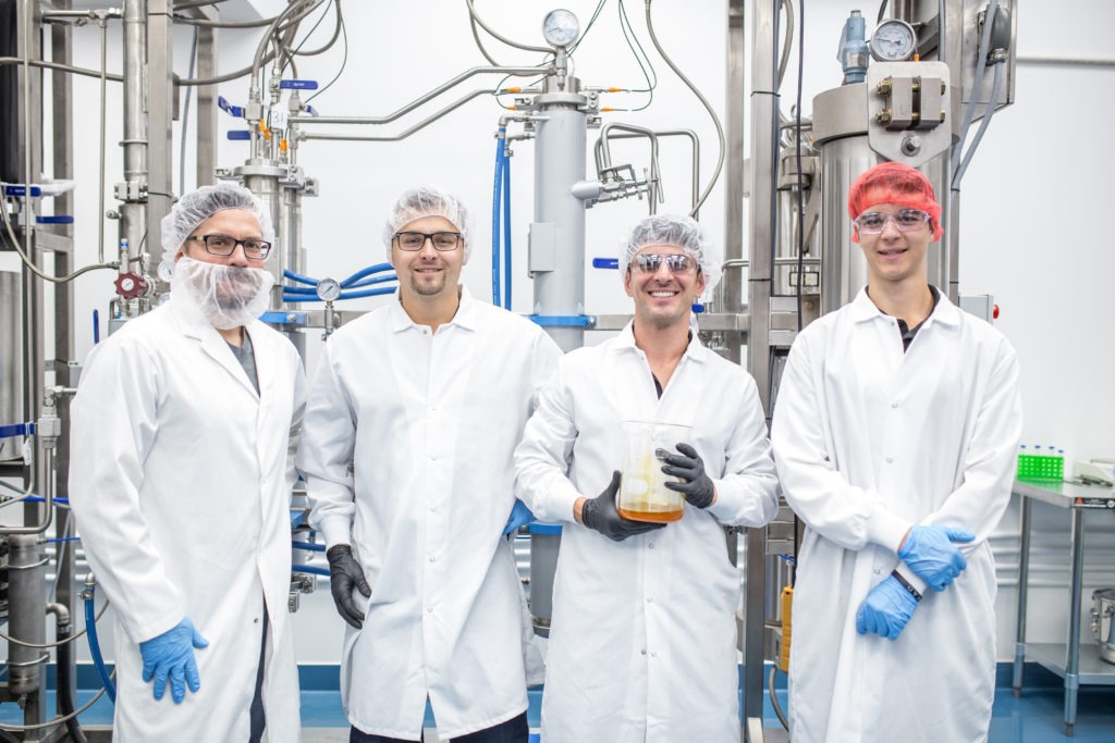 Valens agritech team member photo of four extraction technicians in lab coats